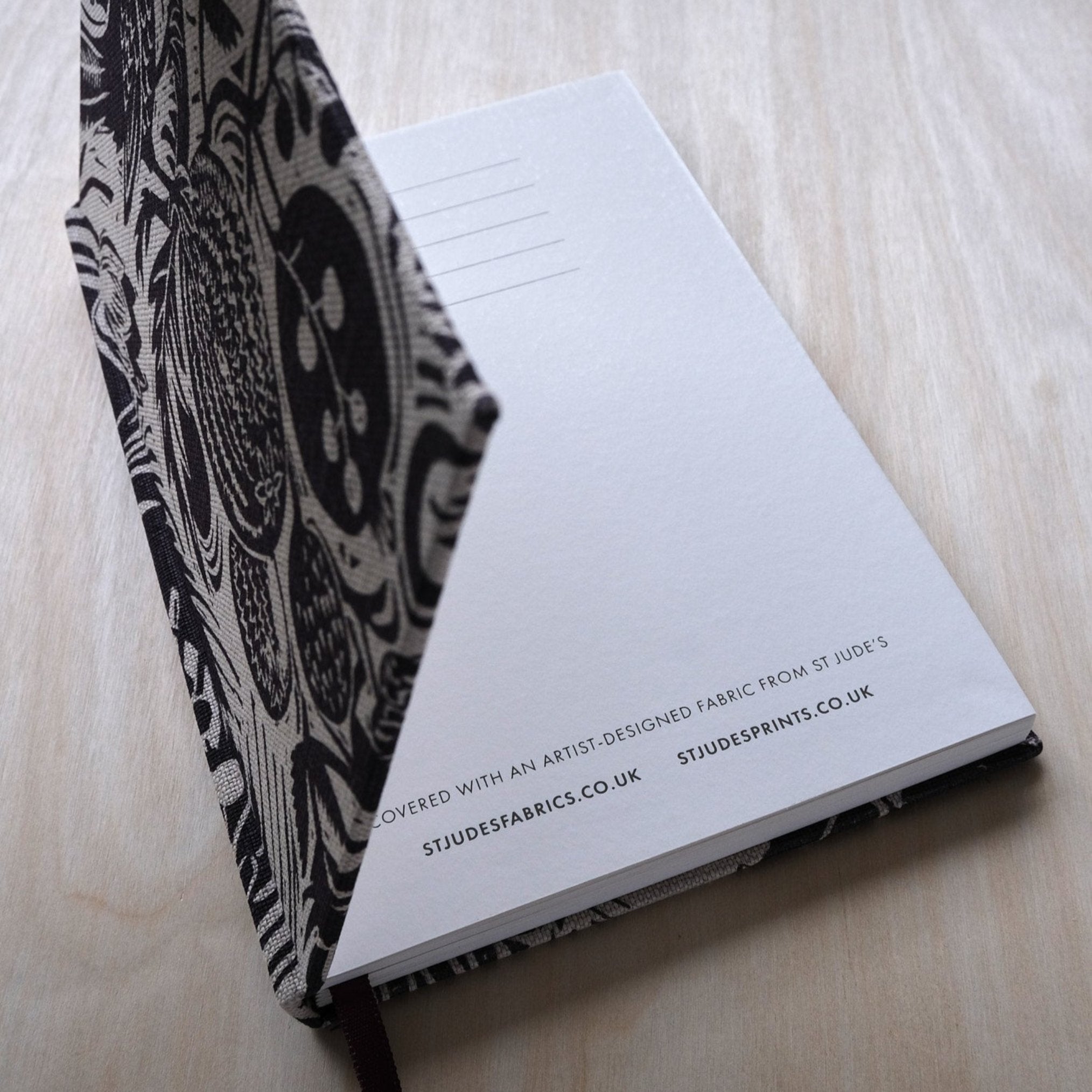 Mark_Hearld__Squirrel_Sunflower__Aubergine_notebook_open_first_page
